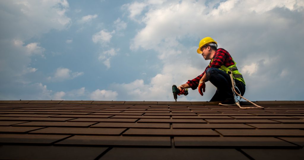 A roofer performing a roof tune up on a home in Ohio.