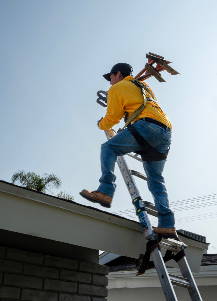 Bumble Roofing of The Woodlands getting ready to remove & replace damaged shingles they detected after a thorough roof inspection.